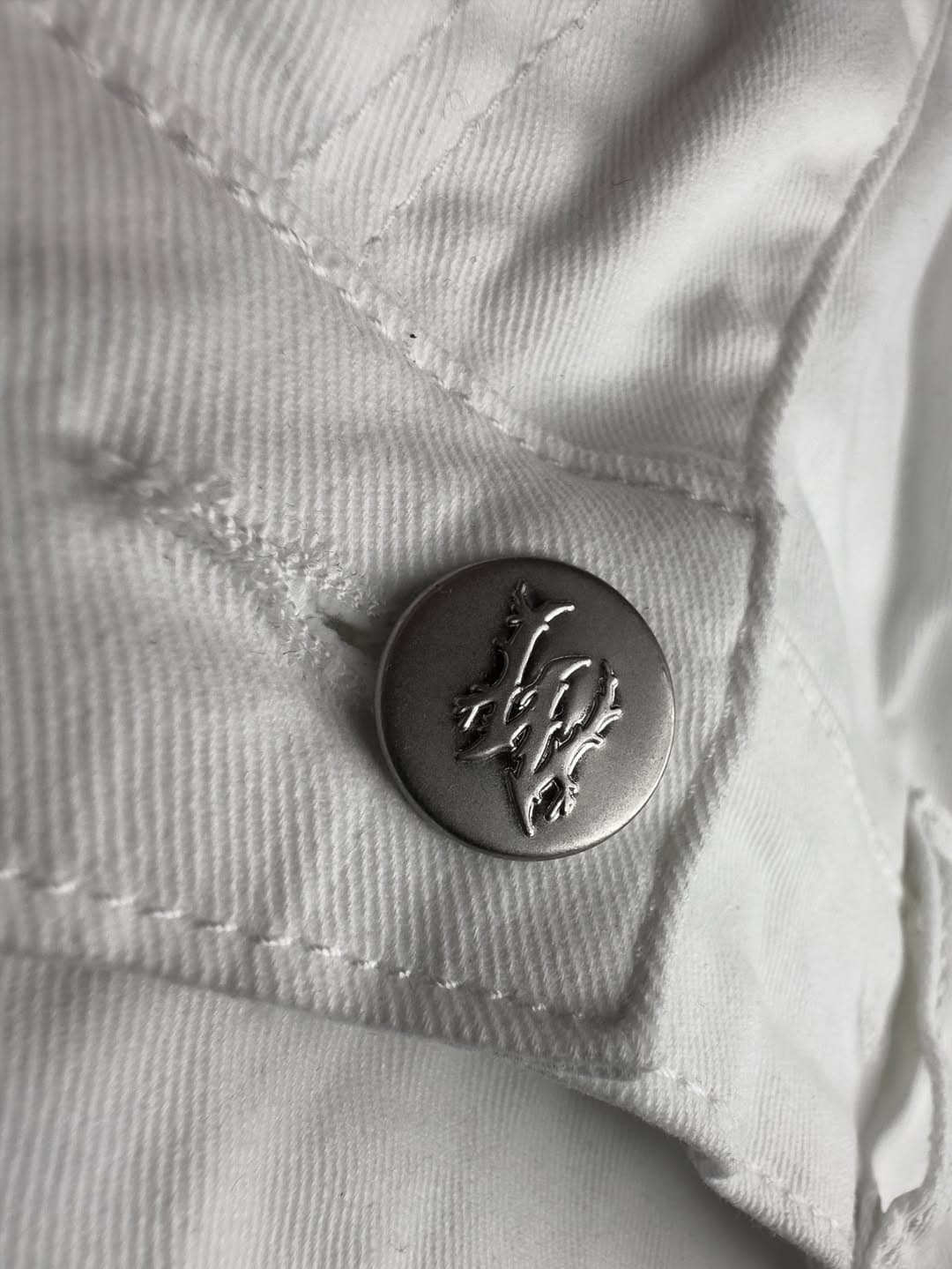 WHYTE Bootcut — signed metal shank button close-up