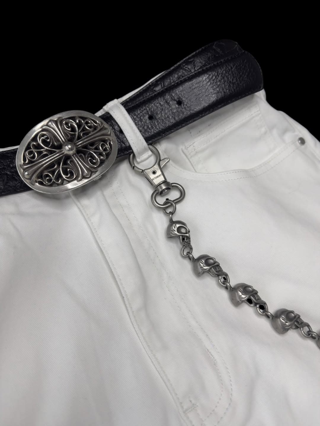 WHYTE Bootcut — silver cross belt buckle and skull chain detail
